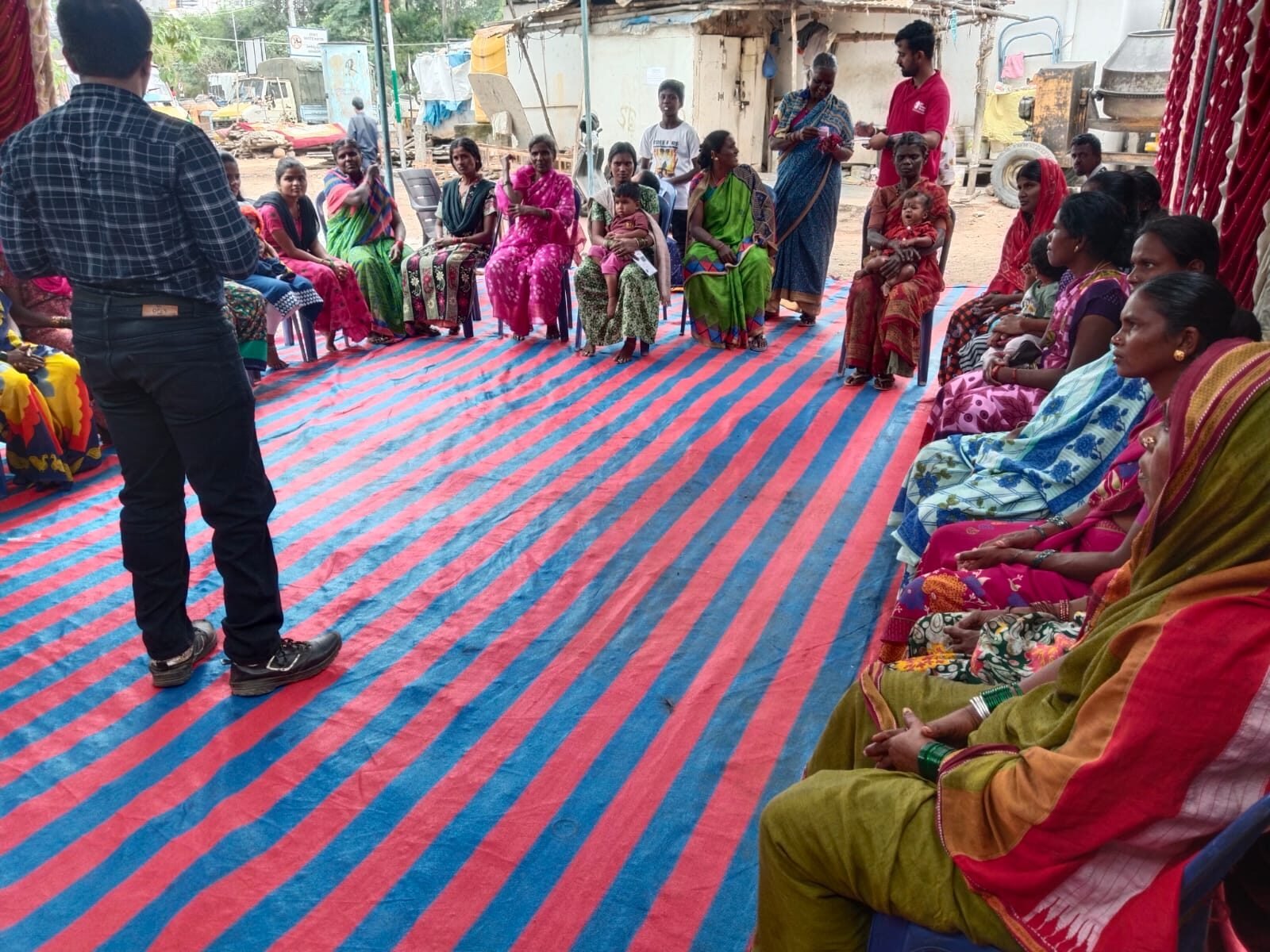 Women from migrant construction-worker communities gathered for an awareness session